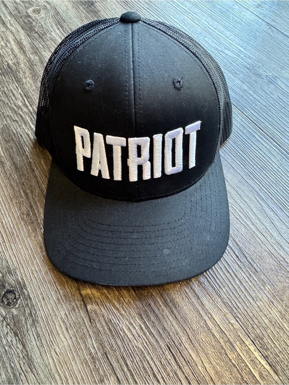 Black Patriot Trucker Hat with White Embroidered Logo